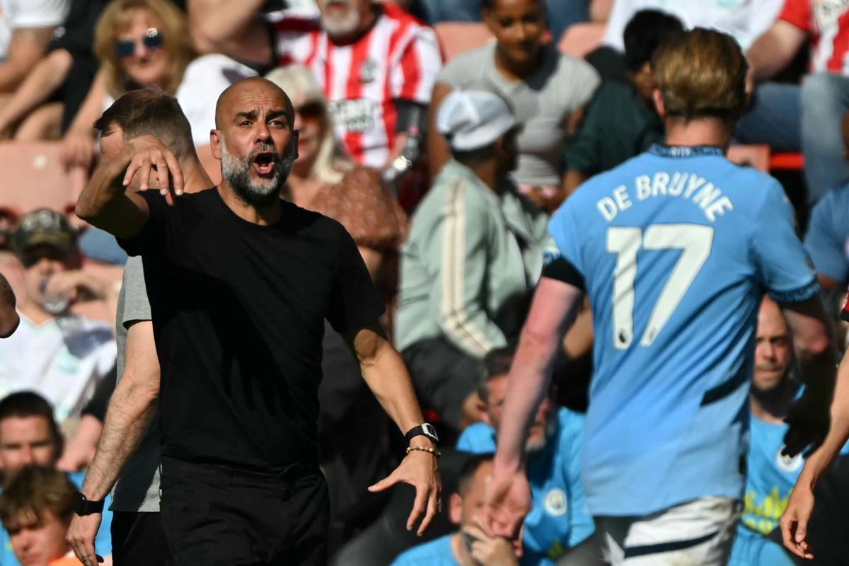 Manchester City's Spanish manager Pep Guardiola gestures on the touchline during the English Premier League football match between Southampton and Manchester City at St Mary's Stadium in Southampton, southern England on May 10, 2025. (Photo by Glyn KIRK / AFP) / RESTRICTED TO EDITORIAL USE. No use with unauthorized audio, video, data, fixture lists, club/league logos or 'live' services. Online in-match use limited to 120 images. An additional 40 images may be used in extra time. No video emulation. Social media in-match use limited to 120 images. An additional 40 images may be used in extra time. No use in betting publications, games or single club/league/player publications. /. SEE CAPTION FOR MORE INFORMATION / RESTRICTED TO EDITORIAL USE. No use with unauthorized audio, video, data, fixture lists, club/league logos or 'live' services. Online in-match use limited to 120 images. An additional 40 images may be used in extra time
