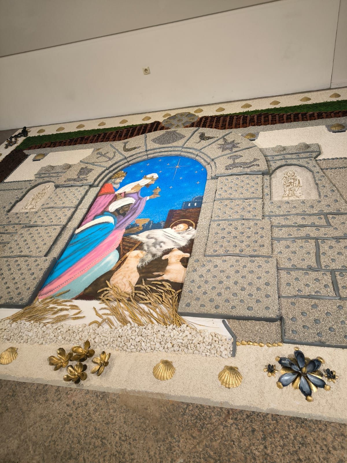 La inauguración de la alfombra "A maxia dos Santos Reis" en Bueu