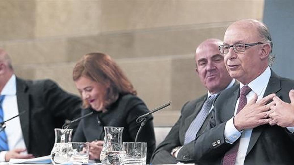 De izquierda a derecha, Wert, Santamaría, Guindos y Montoro