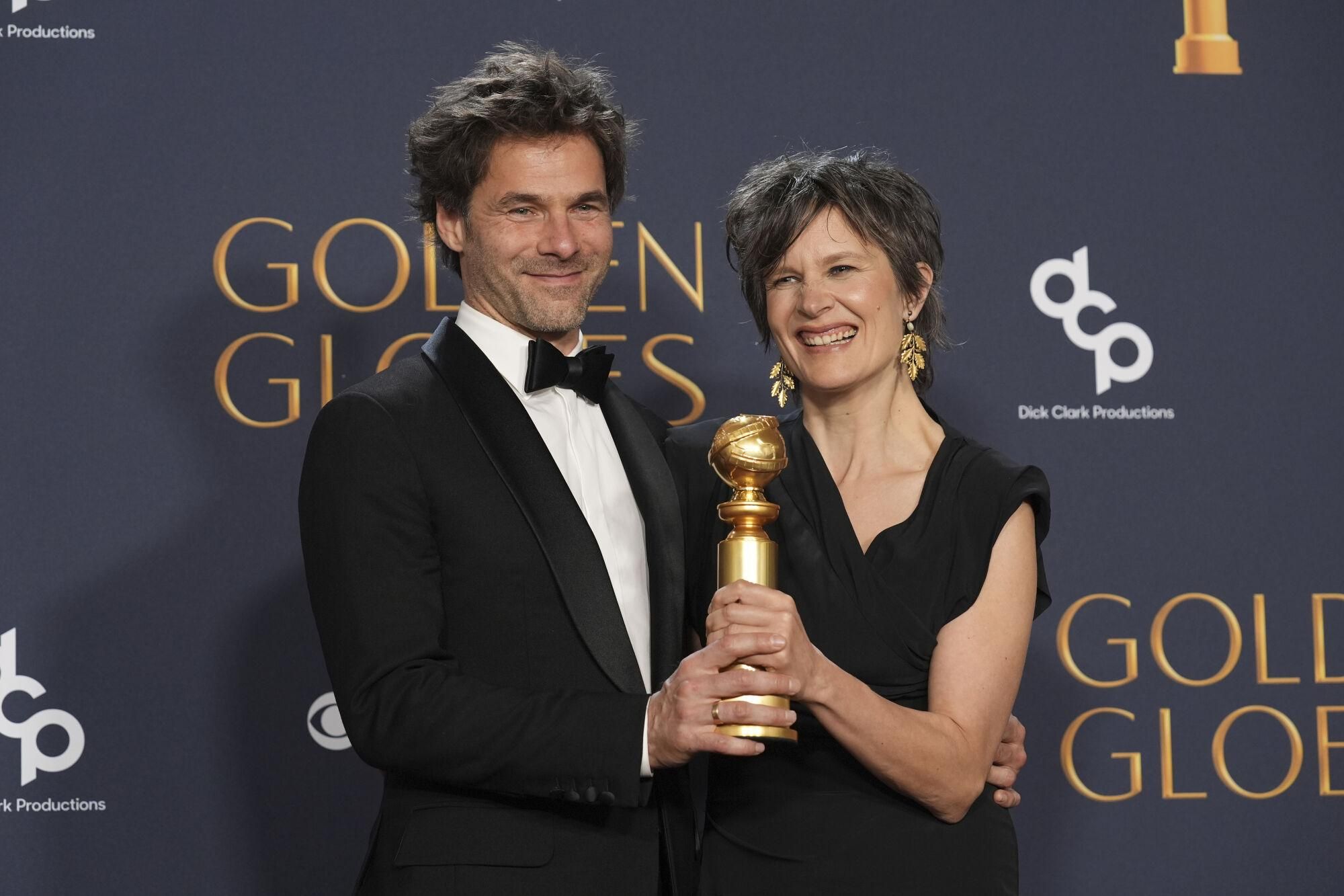 Clément Ducol, left, and Camille pose in the press room with the award for best original song - motion picture for "El Mal," from "Emilia Perez" in the press room during the 82nd Golden Globes on Sunday, Jan. 5, 2025, at the Beverly Hilton in Beverly Hills, Calif. (AP Photo/Chris Pizzello). 010525131219, 21334631,