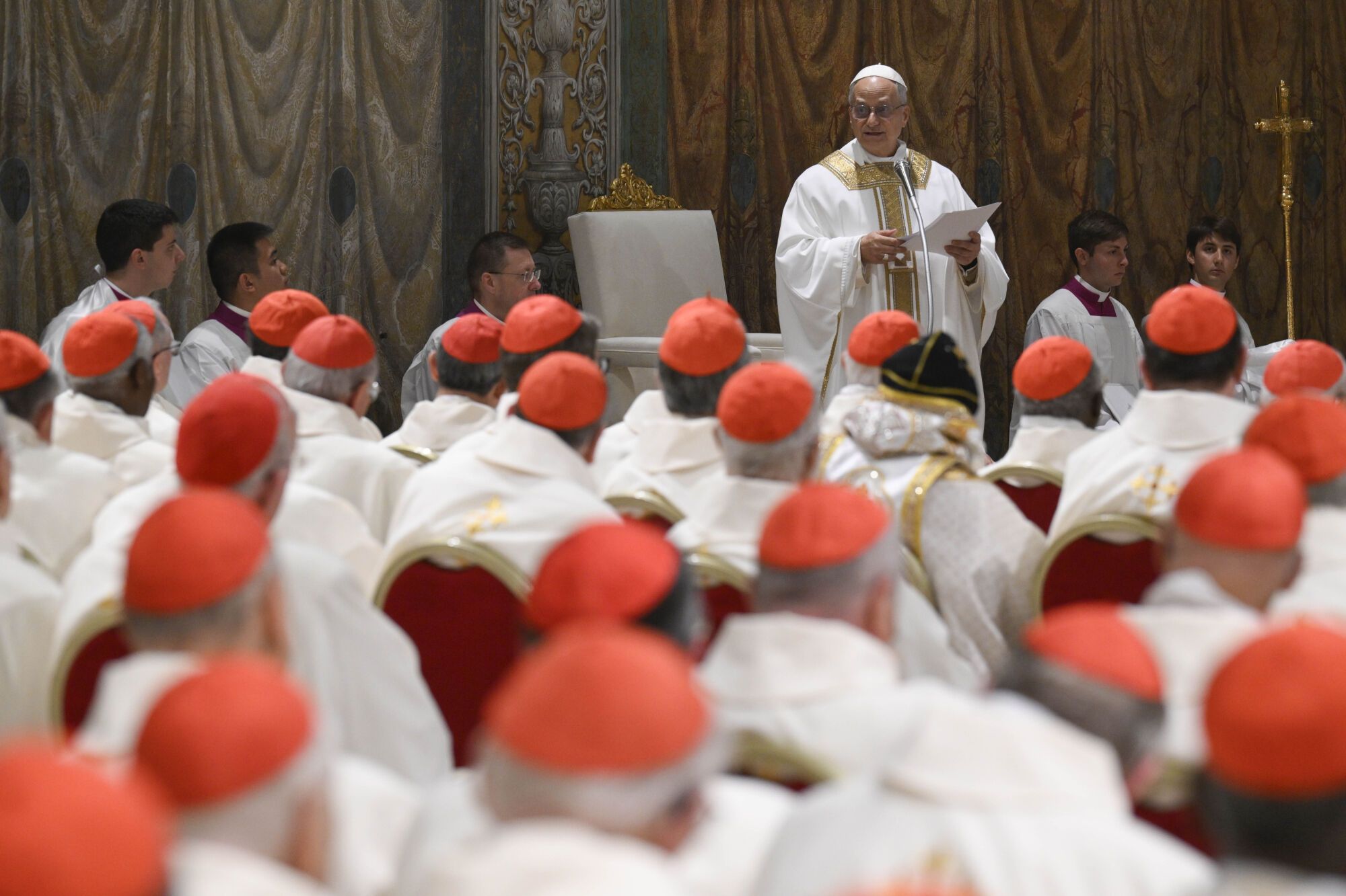 Newly elected Pope Leo XIV concelebrates Mass with the College of Cardinals inside the Sistine Chapel at the Vatican the day after his election as 267th pontiff of the Roman Catholic Church, Friday, May 9, 2025. (Vatican Media via AP). AP PROVIDES ACCESS TO THIS GOVERNMENT PRODUCED PHOTO SOLELY TO ILLUSTRATE NEWS REPORTING OR COMMENTARY ON FACTS DEPICTED IN IMAGE; MUST BE USED WITHIN 14 DAYS FROM TRANSMISSION; NO ARCHIVING; NO LICENSING; MANDATORY CREDIT