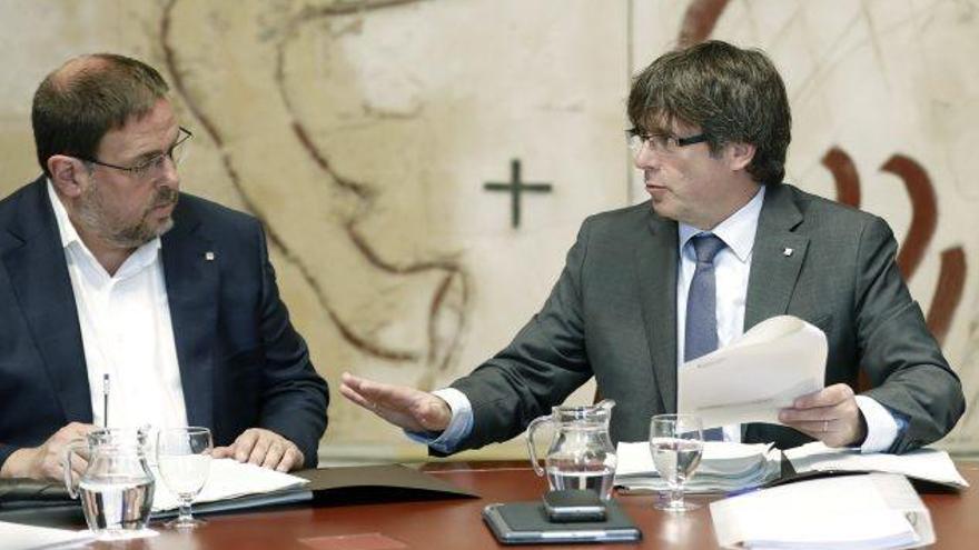 El President de la Generalitat, Carles Puigdemont, i el vicepresident, Oriol Junqueras, en una reunió recent