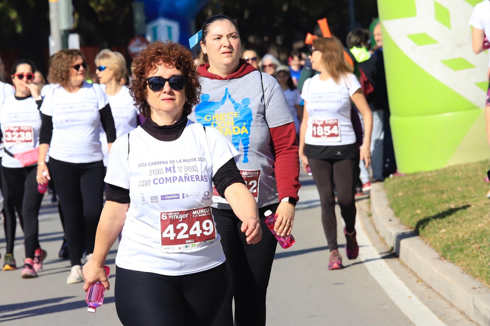 La salida y el recorrido de la Carrera de la Mujer 'inmortalizados' en imágenes