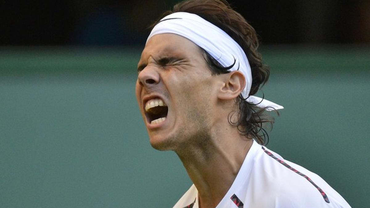 Rafael Nadal of Spain reacts in his men's singles tennis match against Lukas Rosol of the Czech Republic at the Wimbledon tennis championships in London