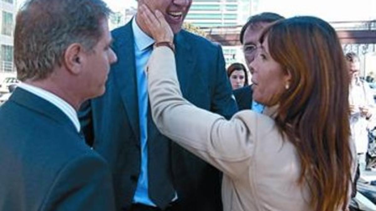 García Albiol, en el centro, arropado por Sánchez-Camacho y Fernández Díaz, ayer en la Ciutat de la Justícia.