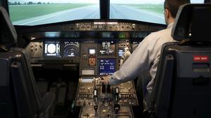 Gerhard Lueck  CEO of ViennaFlight  sits in the cockpit of an Airbus A320 flight simulator in Vienna on March 26  2015  REUTERS Leonhard Foeger
