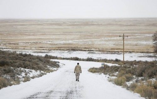 An occupier walks along a road at the Malheur National Wildlife Refuge near Burns, Oregon