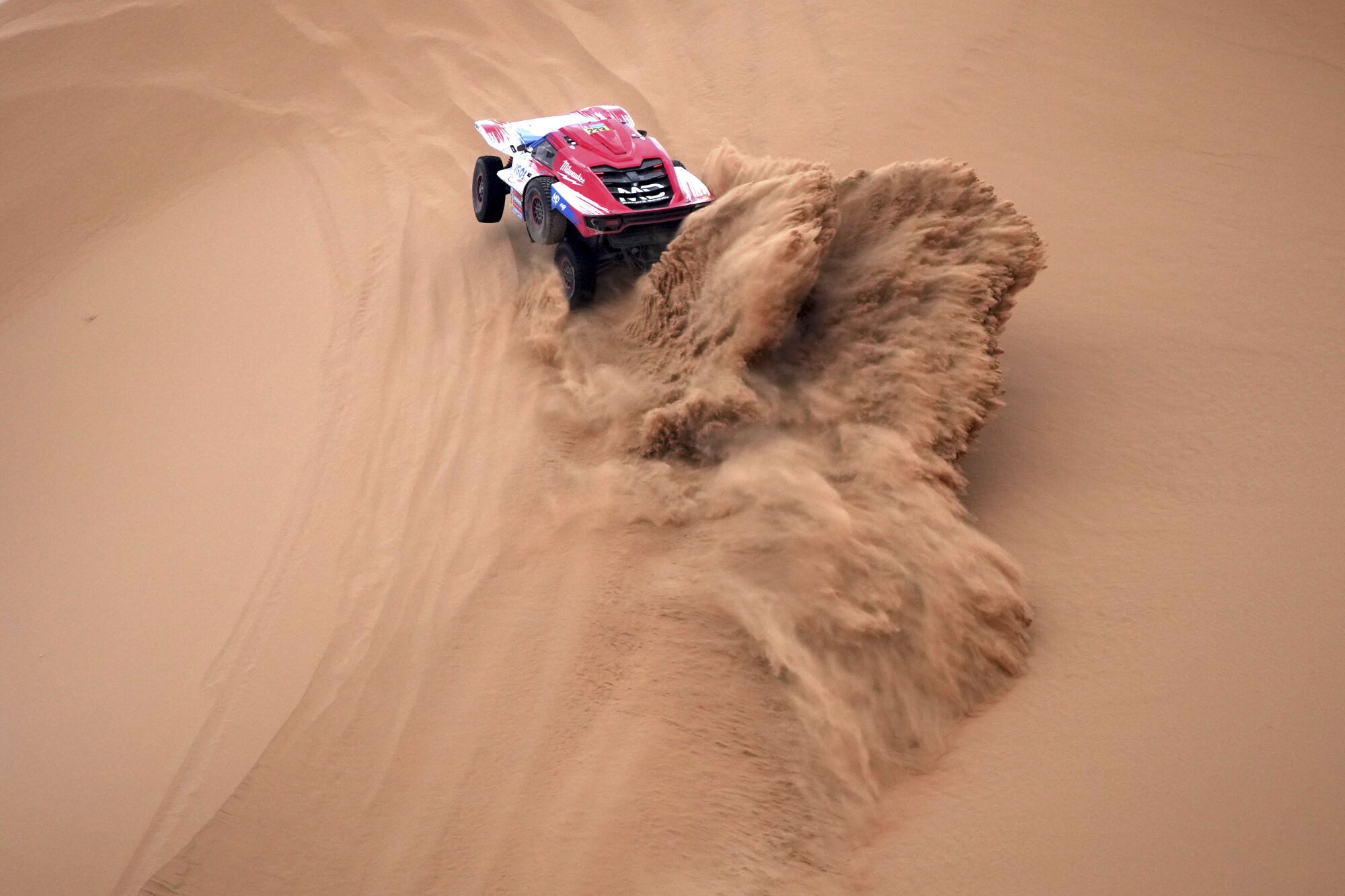 Driver Simon Vitse and co-driver Max Delfino compete during the seventh stage of the Dakar Rally with start and finish in Al Duwadimi, Saudi Arabia, Sunday, Jan. 12, 2025. (AP Photo/Christophe Ena). EDITORIAL USE ONLY/ONLY ITALY AND SPAIN