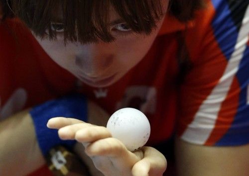 South Korea's Seo tosses the ball as she serves to Russia's Troshneva during the World Team Table Tennis Championships in Tokyo