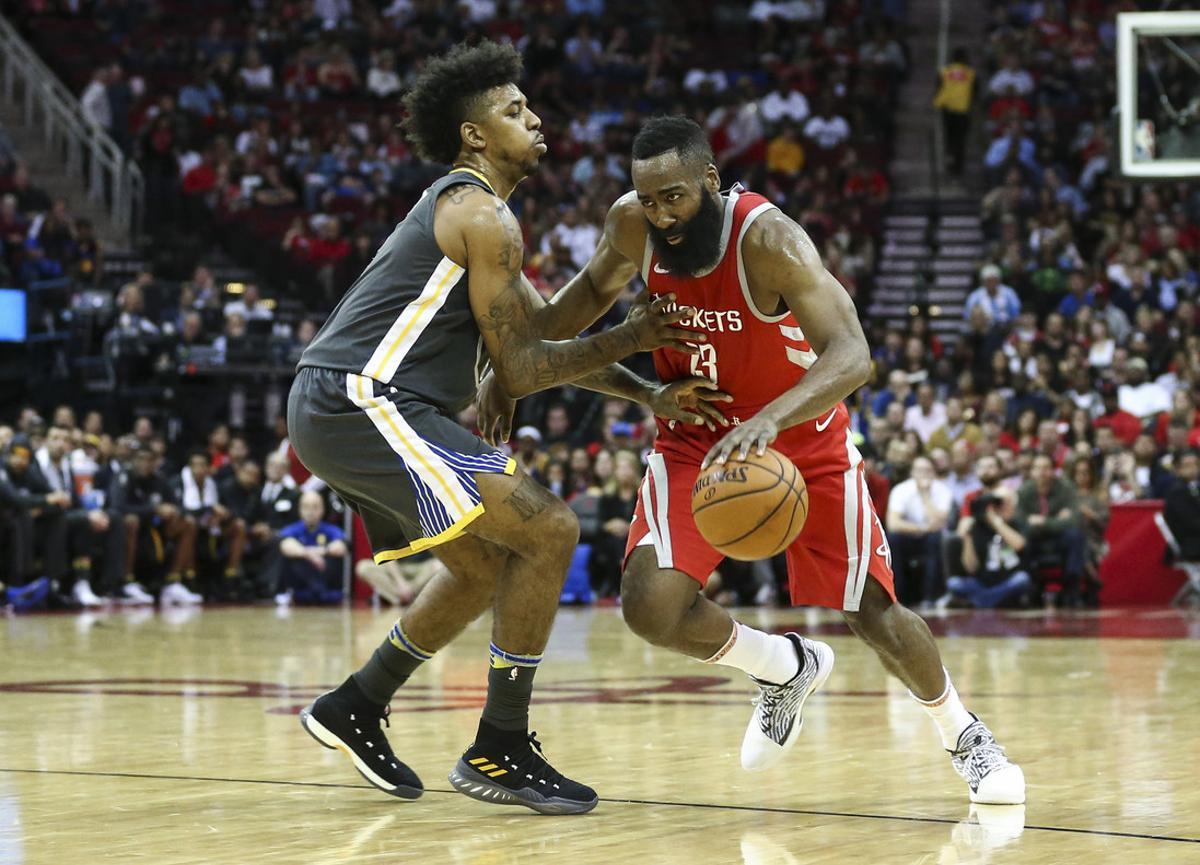 Jan 20, 2018; Houston, TX, USA; Houston Rockets guard James Harden (13) dribbles the ball as Golden State Warriors guard Nick Young (6) defends during the second quarter at Toyota Center. Mandatory Credit: Troy Taormina-USA TODAY Sports