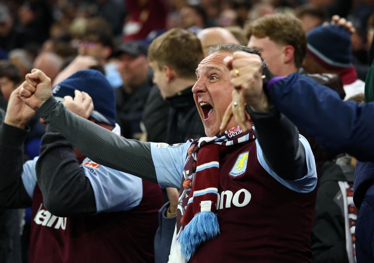 Soccer Football - Champions League - Quarter Final - Second Leg - Aston Villa v Paris St Germain - Villa Park, Birmingham, Britain - April 15, 2025 An Aston Villa fan celebrates their third goal scored by Aston Villa's Ezri Konsa Action Images via Reuters/Matthew Childs