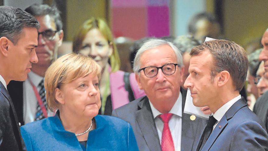 Sánchez, Merkel y Macron en una foto de archivo.