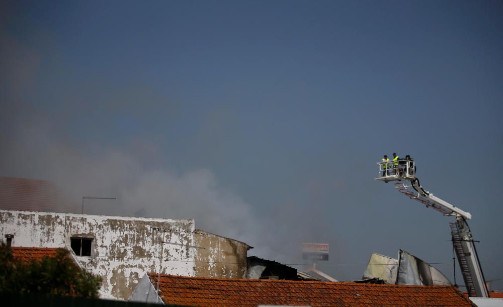 Smoke is seen where a small airplane crashed ...