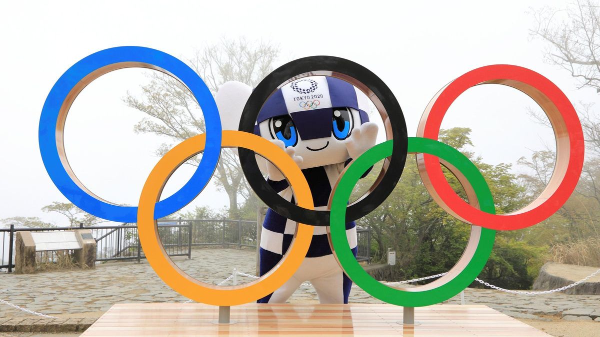 The Tokyo Olympics mascot poses with the Olympic rings The Tokyo Olympics mascot poses with the Olympic rings