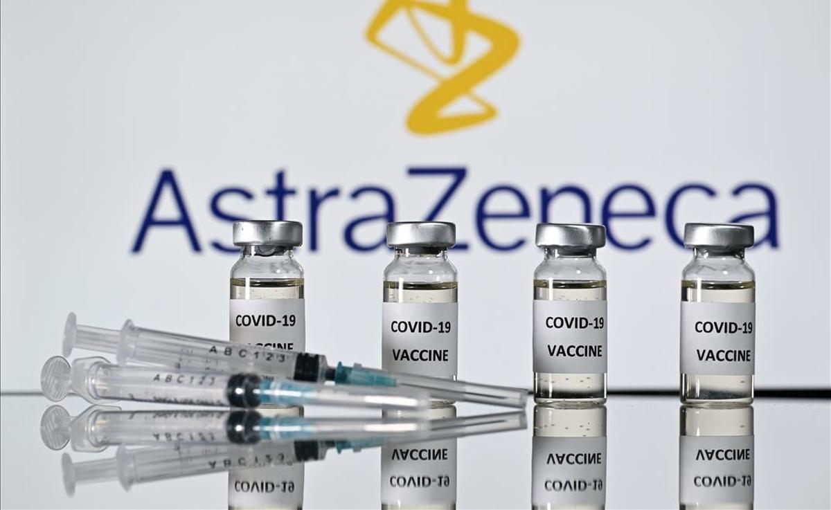 (FILES) In this file photo taken on November 17  2020 An illustration picture shows vials with Covid-19 Vaccine stickers attached and syringes with the logo of British pharmaceutical company AstraZeneca  - Pharmaceutical giant AstraZeneca s Russian branch said on December 11  2020 it would use part of Russia s homemade Sputnik V vaccine in further clinical trials  (Photo by JUSTIN TALLIS   AFP)