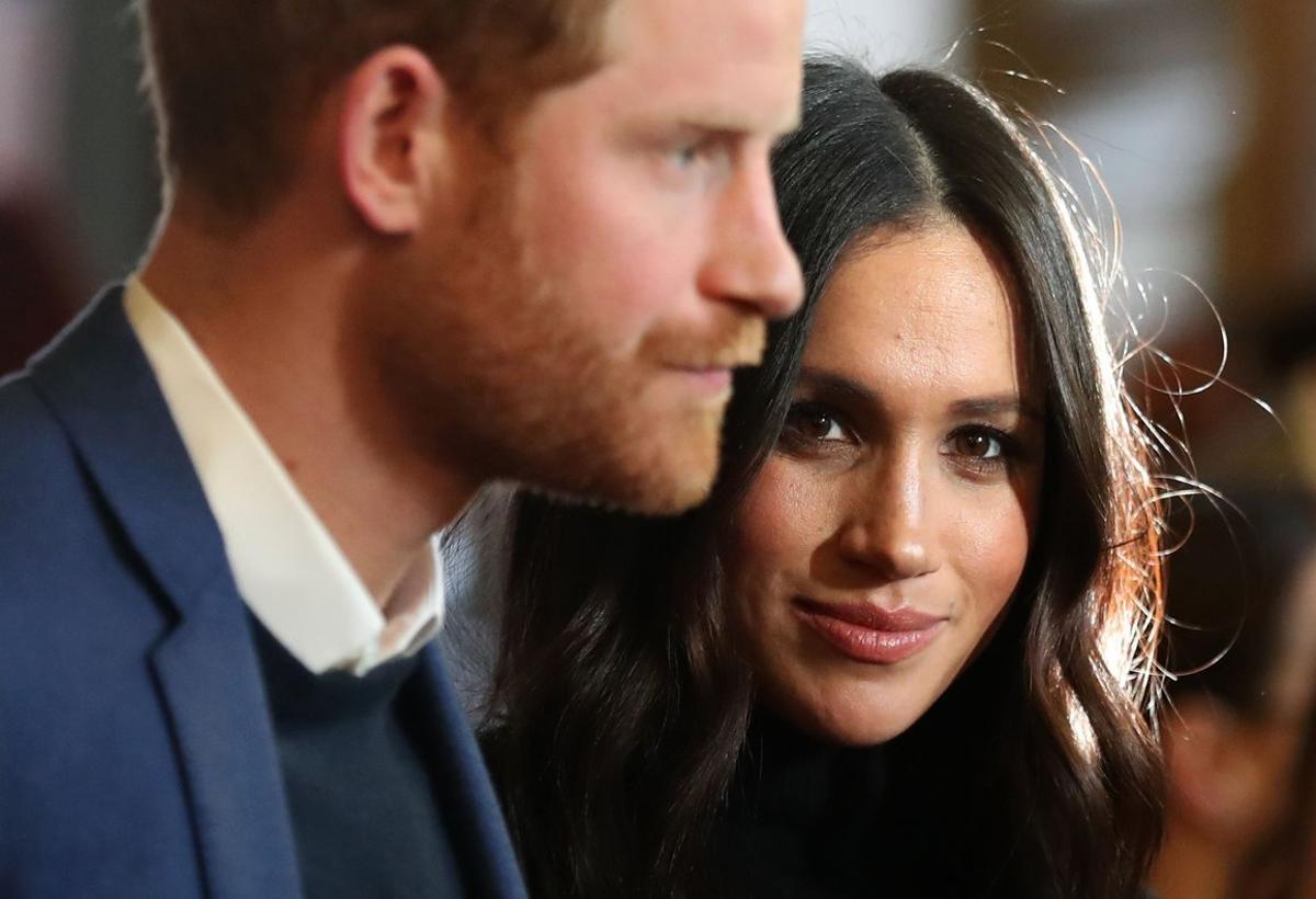 FILED - 13 February 2018, England, London: Prince Harry (L) and his wife Meghan, the Duke and Duchess of Sussex. Britain’s Prince Harry and his wife Meghan are no longer working members of the Royal Family,Â Buckingham Palace said in a statement released late Saturday. Photo: Andrew Milligan/PA Wire/dpa