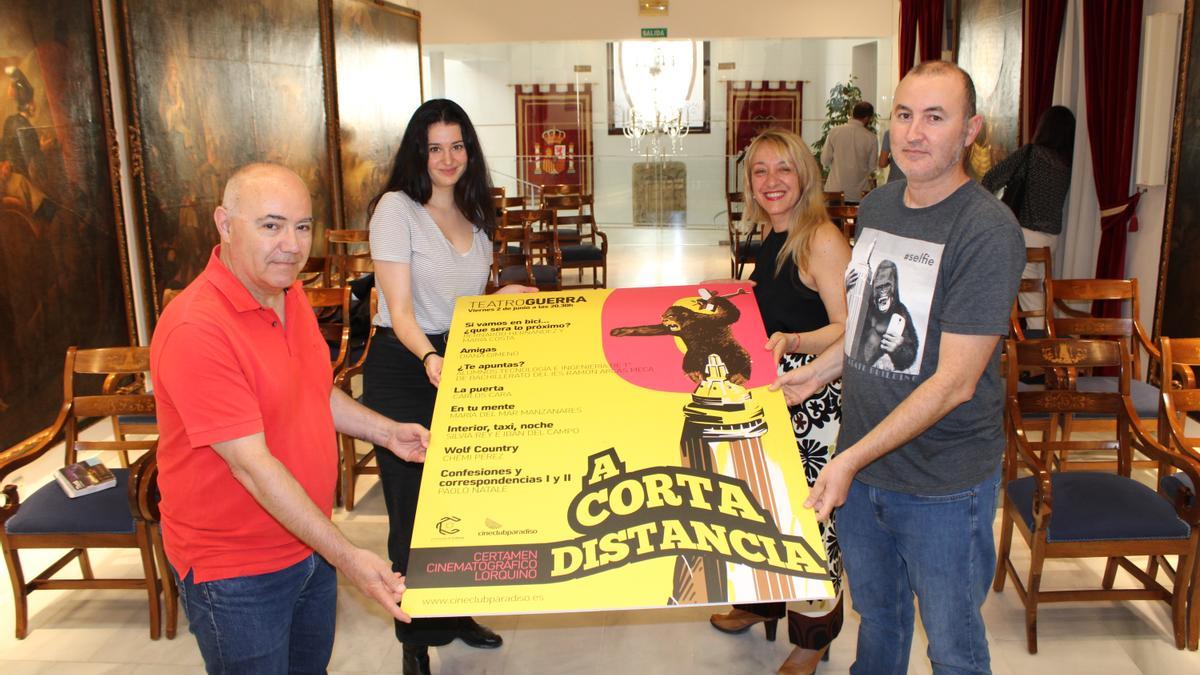 Jesús Martínez, María Costa, María Ángeles Mazuecos y José Ruiz Montalván, con el cartel, este jueves.