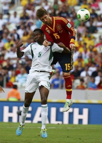 Spain's Ramos fights for the ball with Nigeria's Ambrose during their Confederations Cup Group B soccer match at the Estadio Castelao in Fortaleza