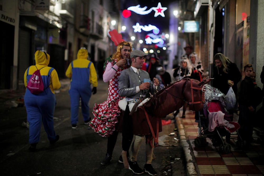 Revellers dressed up as an Andalusian horseman ...