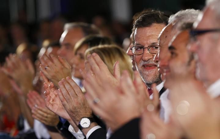Spanish Prime Minister and People's Party (PP) leader Mariano Rajoy smiles during a campaign rally ahead of Spain's general election in Valencia