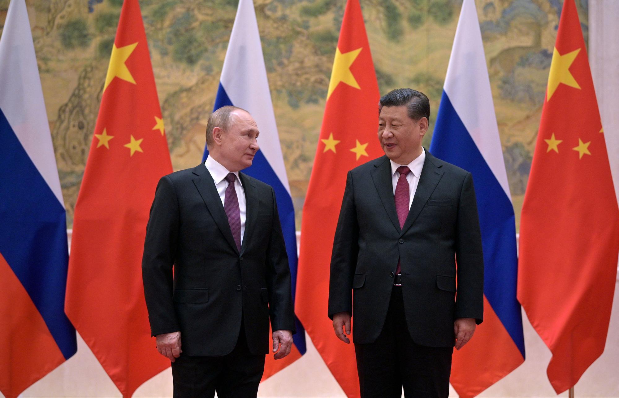 Vladimir Putin, con Xi Jinping.