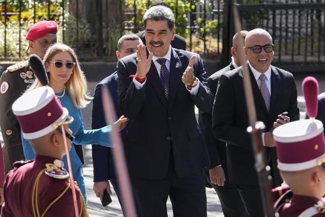 Venezuelan President Nicolas Maduro, his wife Cilia Flores, left, and National Assembly President Jorge Rodriguez, right, arrive at the National Assembly for his swear-in ceremony for a third term in Caracas, Venezuela, Friday, Jan. 10, 2025.(AP Photo/Matias Delacroix)