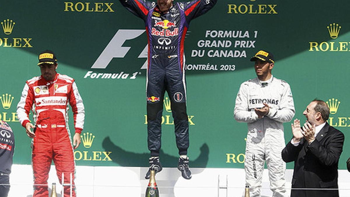 Sebastian Vettel (centro), Fernando Alonso y Lewis Hamilton, en el podio del GP de Canadá