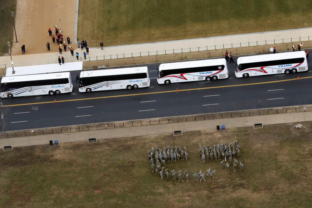 Members of the military enter formation before ...