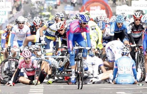 BMC Team rider Phinney lies down after crashing during the final rush of the 190-km third stage of the Giro d'Italia in Horsens