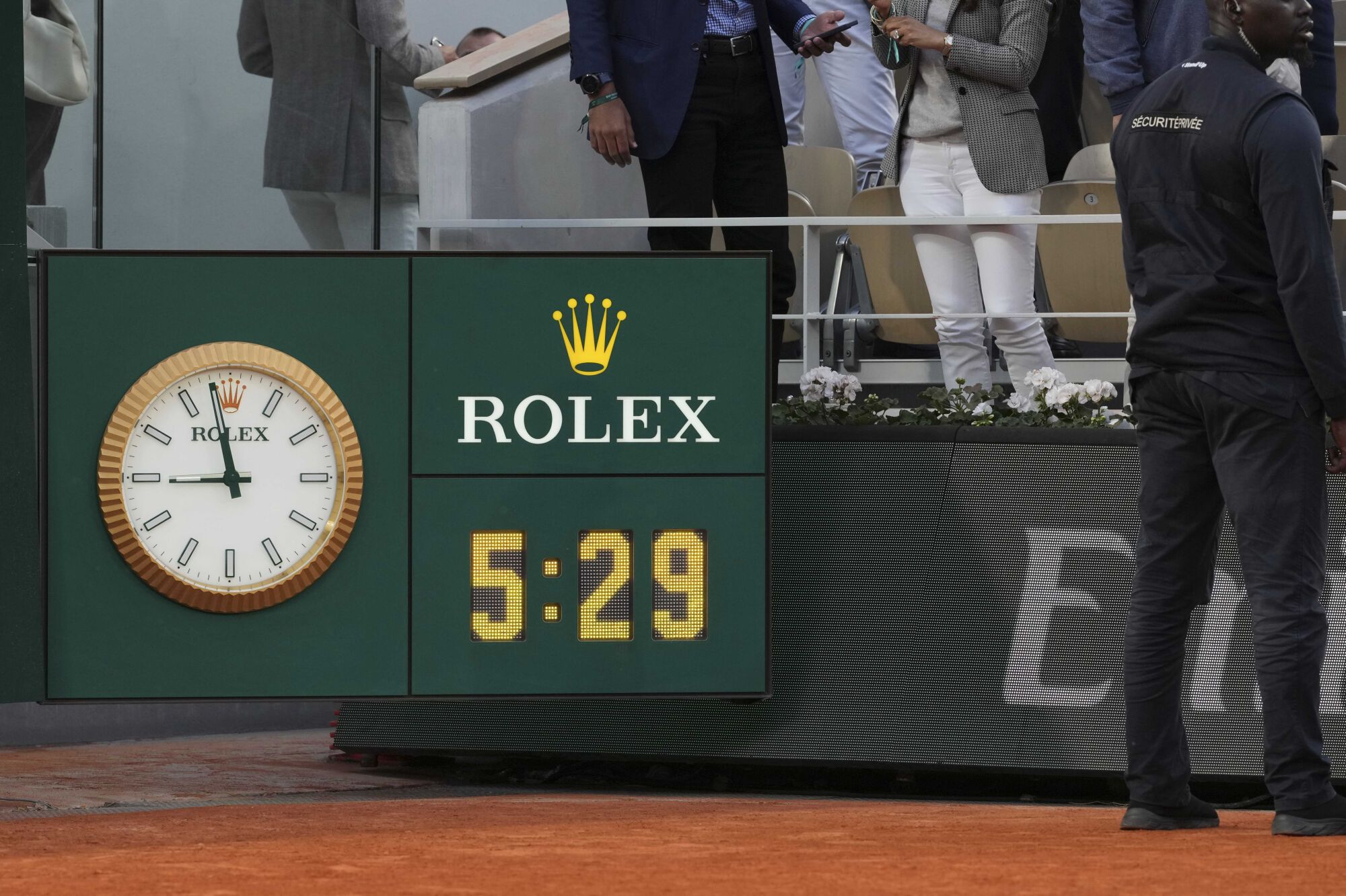 The clock shows the final time: 5 hours and 29 minutes of the final match of the French Tennis Open between Italy's Jannik Sinner and winner Spain's Carlos Alcaraz at the Roland-Garros stadium in Paris, Sunday, June 8, 2025. (AP Photo/Thibault Camus). EDITORIAL USE ONLY/ONLY ITALY AND SPAIN