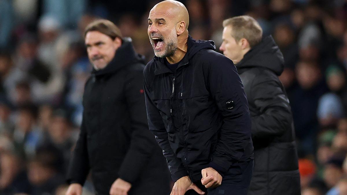 Pep Guardiola shouts instructions from the bench during the match between Manchester City and Leeds United