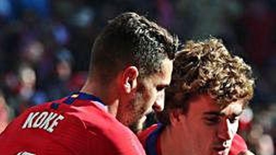 Koke i Griezmann celebren un gol