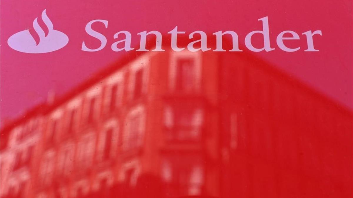 (FILES) In this file photo taken on May 14  2019 the logo of Santander bank is pictured in Madrid on May 14  2019  - Spanish banking giant Santander reported on February 3  2021 a net loss of over 8 7 billion euros for 2020 due to restructuring costs and provisions set aside to cope with the coronavirus crisis  (Photo by GABRIEL BOUYS   AFP)