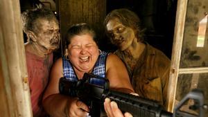 Tourist Amy Powers is approached by Walker Matthew Tomlin during The Walking Dead Tour of a Season 3 location of the AMC production in Haralson, Georgia, U.S. June 15, 2019. Picture taken on June 15, 2019.  REUTERS/Chris Aluka Berry     TPX IMAGES OF THE DAY