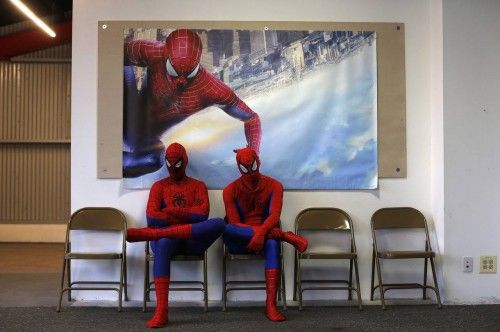 Applicants dressed up as fictional comic book superhero Spider-Man wait for their turn to audition to be a part of a promotional campaign for the upcoming release of "The Amazing Spider-Man 2" in Chicago