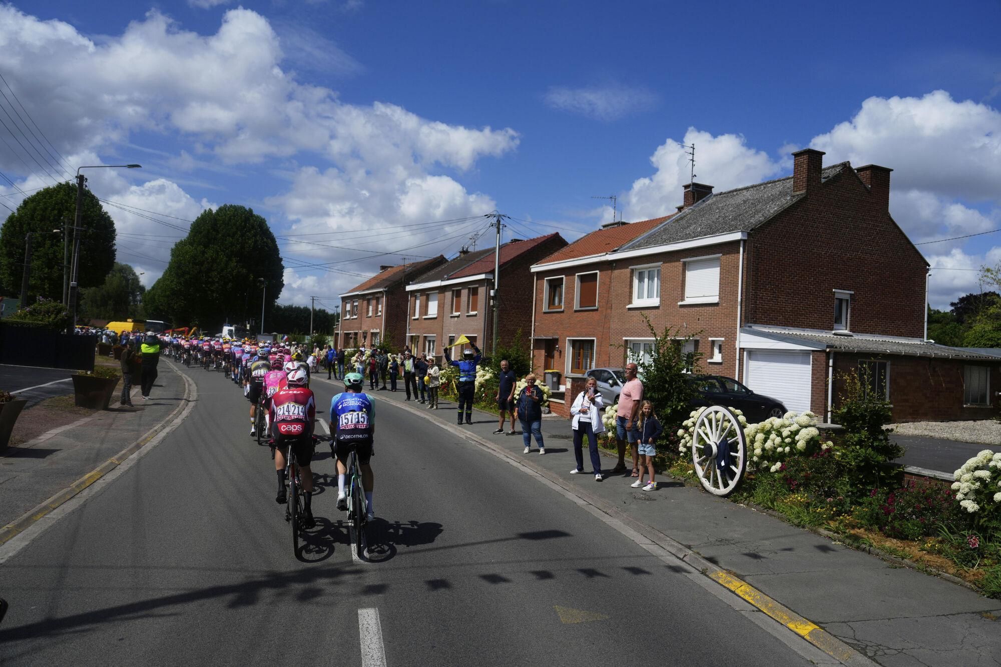 The pack rides during the third stage of the Tour de France cycling race over 178.3 kilometers (110.8 miles) with start in Valenciennes and finish in Dunkerque, France, Monday, July 7, 2025. (AP Photo/Mosa'ab Elshamy) Associated Press / LaPresse Only italy and spain. EDITORIAL USE ONLY/ONLY ITALY AND SPAIN