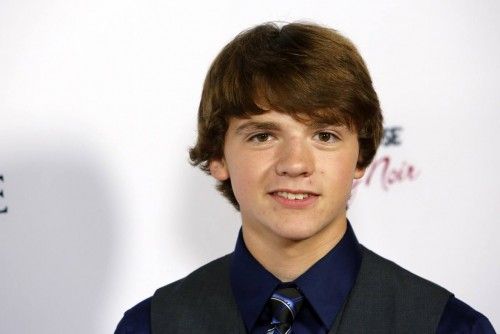 Joel Courtney arrives at the premiere of the movie "The Impossible" in Hollywood