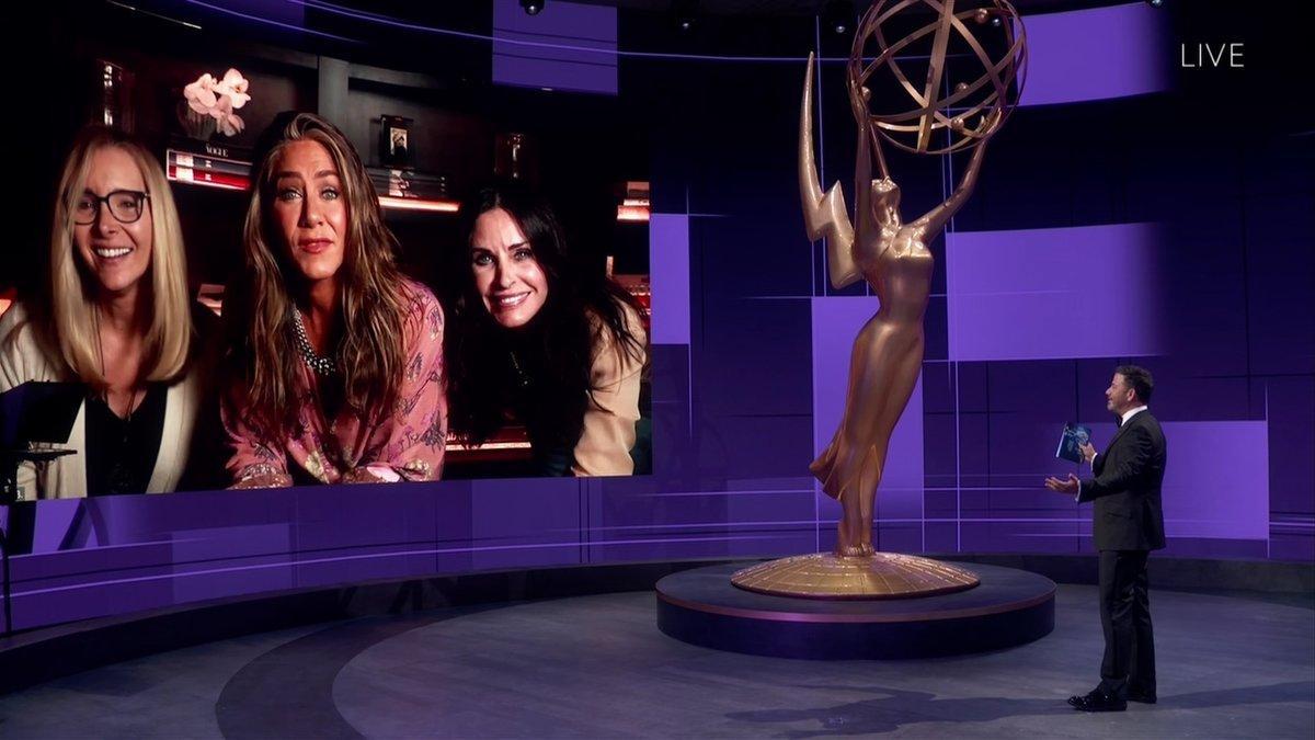 IMAGE DISTRIBUTED FOR THE TELEVISION ACADEMY - Jimmy Kimmel, right, speaks with Lisa Kudrow, Jennifer Aniston and Courteney Cox during the 72nd Emmy Awards telecast on Sunday, Sept. 20, 2020 at 8:00 PM EDT/5:00 PM PDT on ABC. (Invision for the Television Academy/AP)