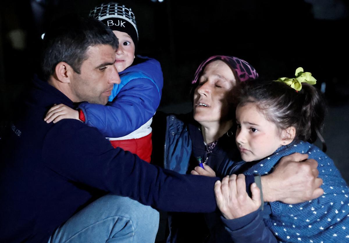 People react after a quake in Antakya in Hatay province, Turkey