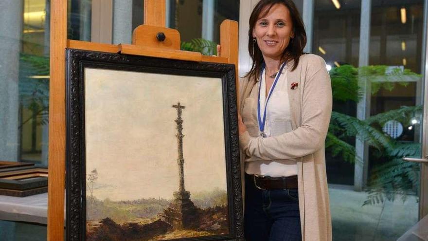 Marta Otero en el Museo de Pontevedra junto a uno de los cuadros de su padre, José Otero Baena. // G.S.