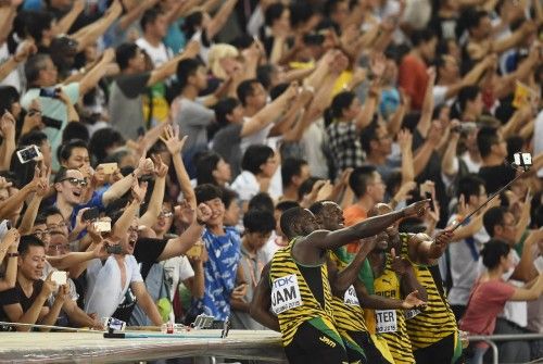 Jamaica relay team poses with a selfie stick after winning the men's 4 x 100 metres relay final at the 15th IAAF Championships in Beijing