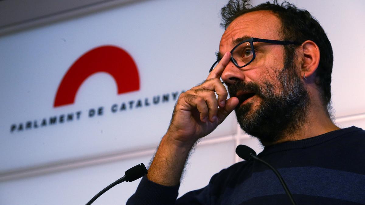 Benet Salellas, a member of CataloniaÂ?s regional assembly, the Parlament, of the leftist CUP party speaks during a press conference at the Parlament in Barcelona