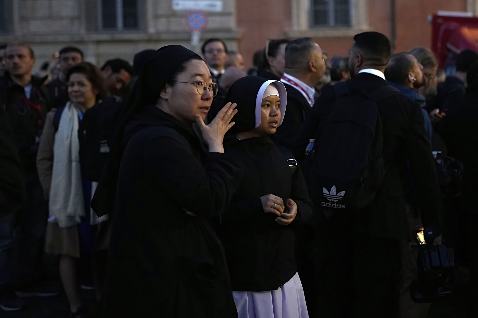 Nuns wait for access to St. Peter's Square ahead of the funeral of Pope Francis at the Vatican, Saturday, April 26, 2025. (AP Photo/Andreea Alexandru)