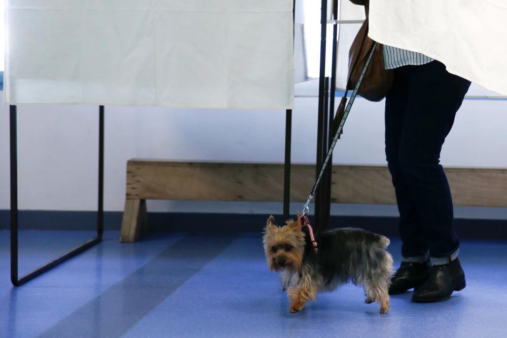 A woman prepares to cast her vote during the ...