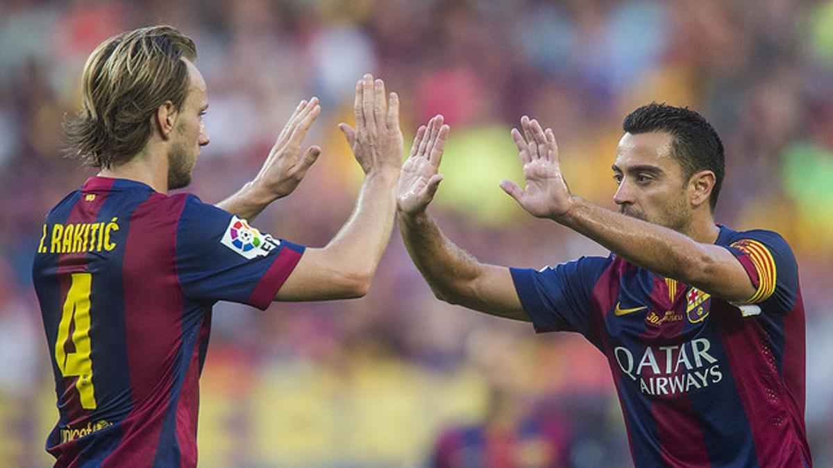 Xavi y Rakitic, en un partido en el Camp Nou