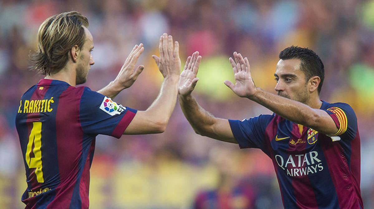 Xavi i Rakitic, en un partit al Camp Nou.