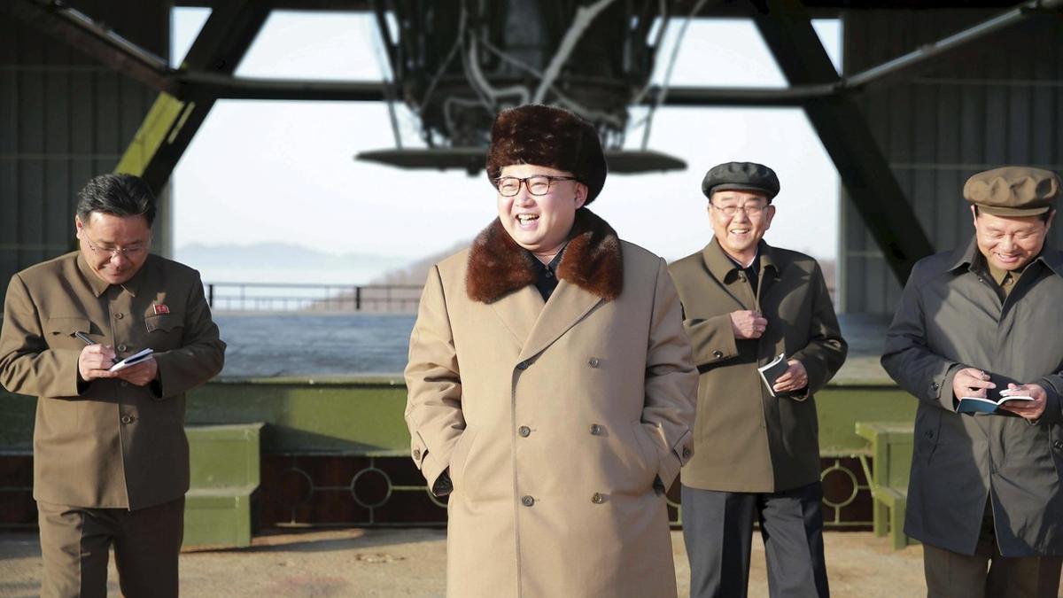 North Korea leader Kim Jong Un smiles as he visits Sohae Space Center for the testing of a new engine for an ICBM