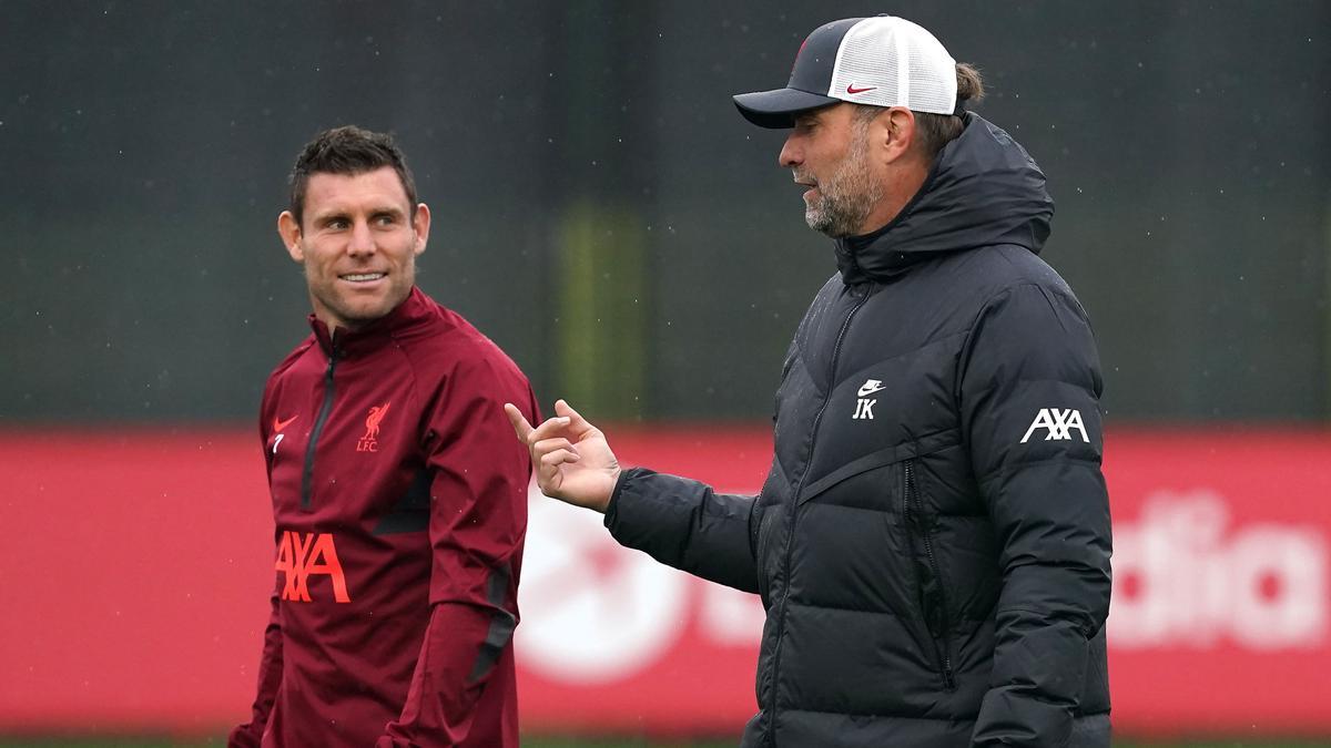 Júrgen Klopp, con Milner.