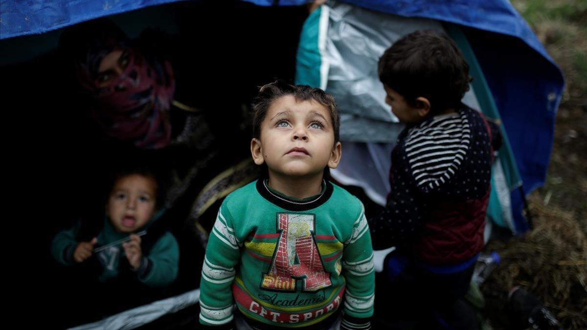 zentauroepp41227861 a syrian refugee boy stands in front of his family tent at a190217150748
