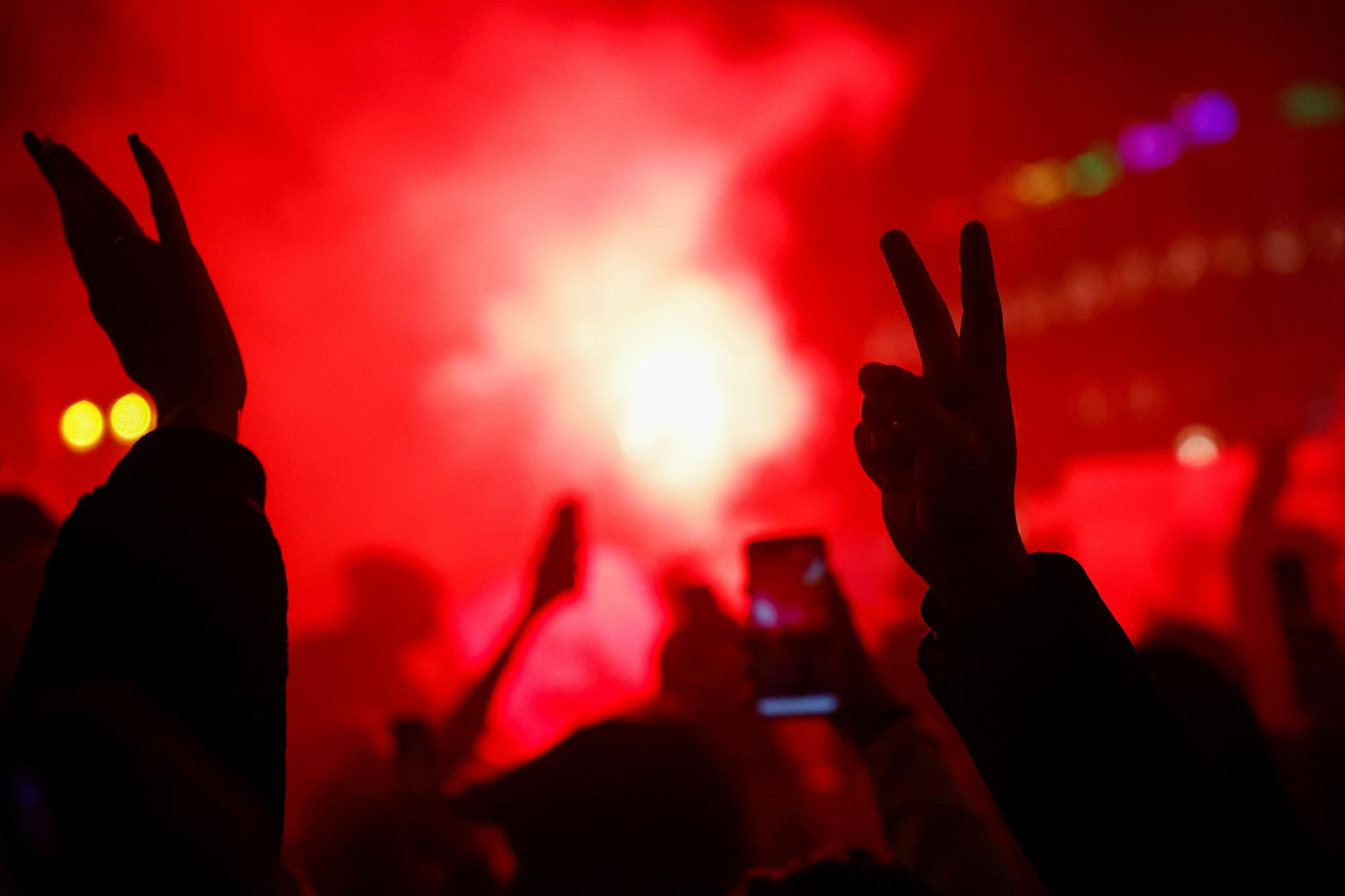 Morocco fans celebrate as they gather in Sol square after the FIFA World Cup Qatar 2022 match between Spain and Morocco, in Madrid